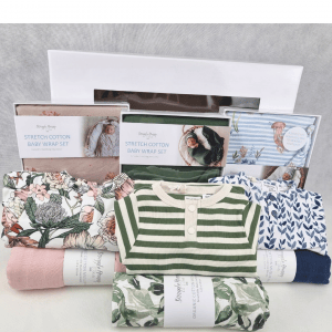 Triplet baby hamper window style with swaddles and clothing in pink, blue and green